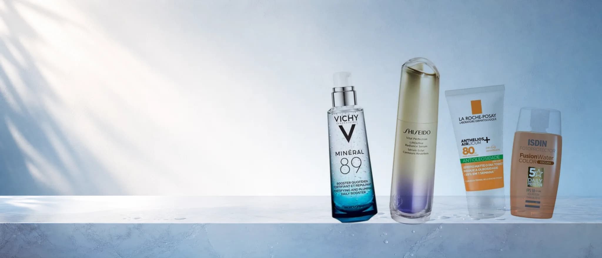 Vichy Minéral 89, sérum Shiseido, protetor La Roche-Posay e ISDIN sobre bancada clara